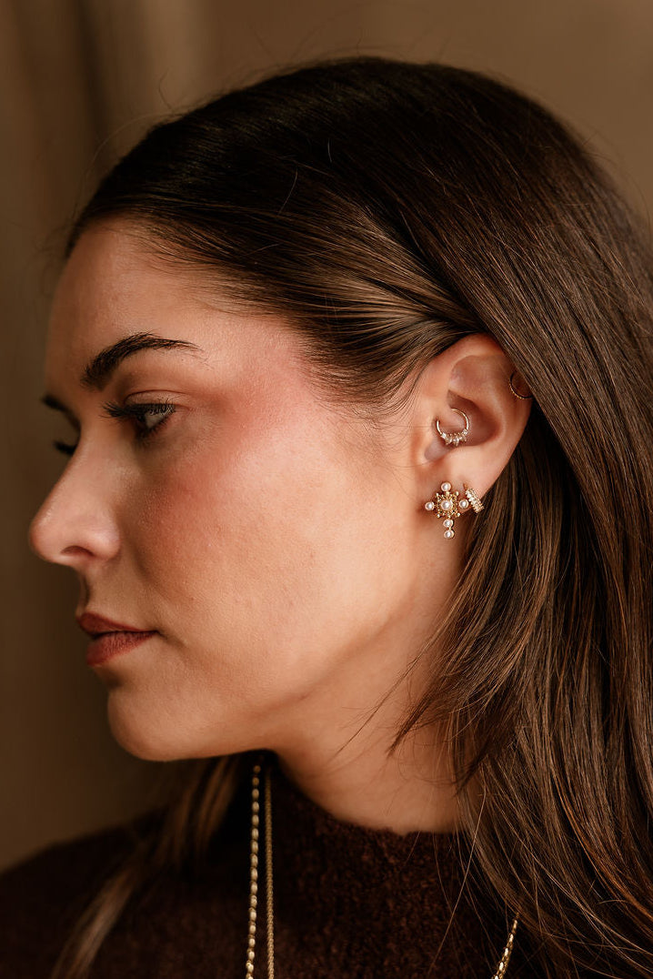 Simone Gold & Pearl Cross Stud Earrings - view of side on model