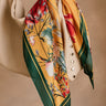 Carmella Mustard Multi Floral Satin Scarf - close up tied on purse