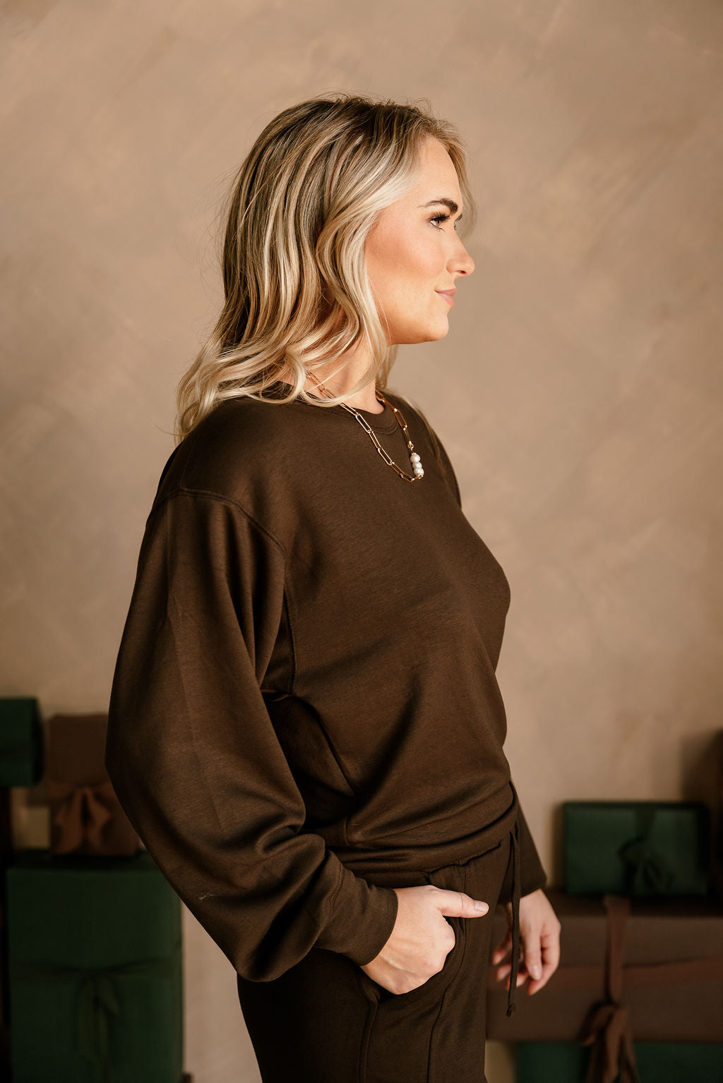 Lina Brown Butter Soft Round Neck Pullover - side view (hand in pocket)