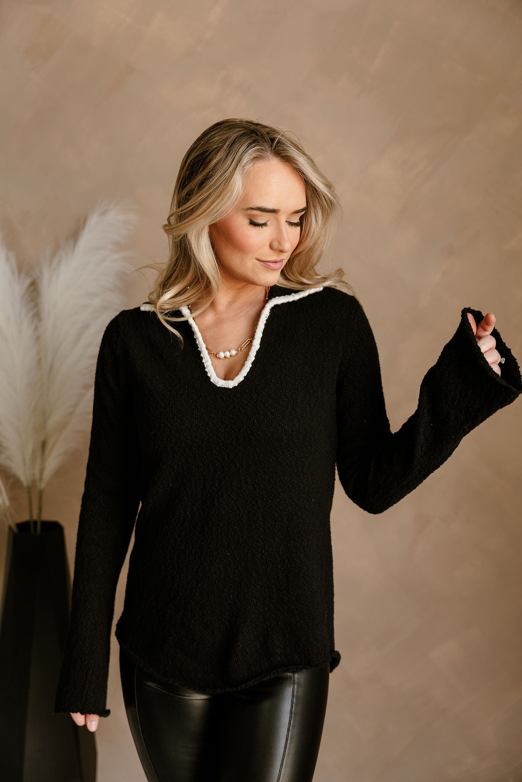 Lanie Black & White Cutout Sweater - front view (arm up)