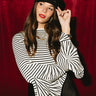 Belle White & Black Striped Flare Sleeve Top - front view (one arm up)