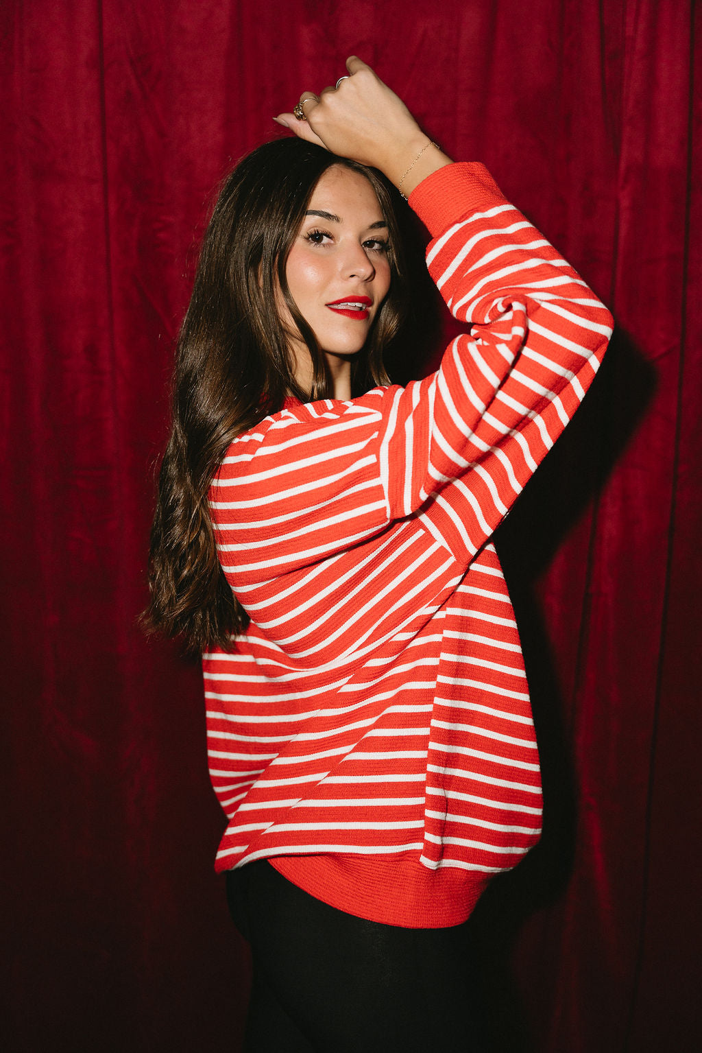 Jolly Red & White Striped Top - side view (arm raised)