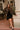 Ashton Black Asymmetric Mini Dress - full body front view with jacket
