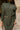 Aster Olive Green Mock Neck Sweater Dress - close up front view with belt