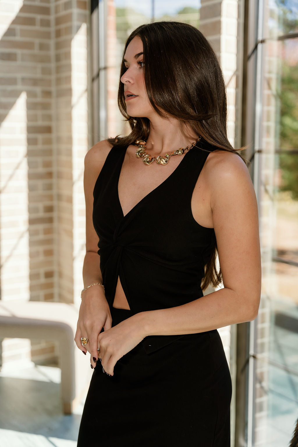 Kaia Black Split Hem Tank- frontal side view