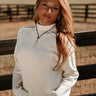 Selah Cream Cable Knit Sweater- frontal side view