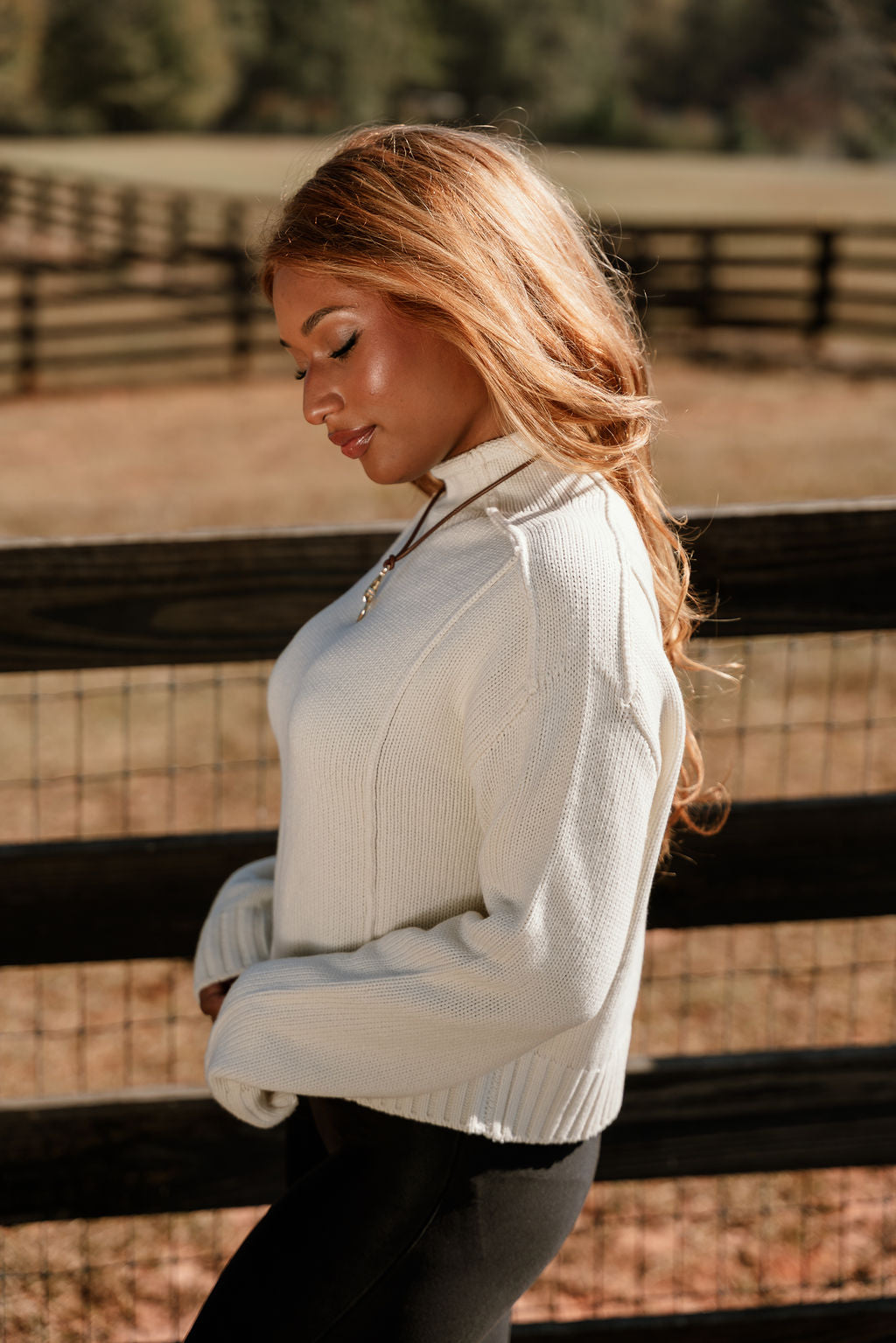 Selah Cream Cable Knit Sweater- close up side view