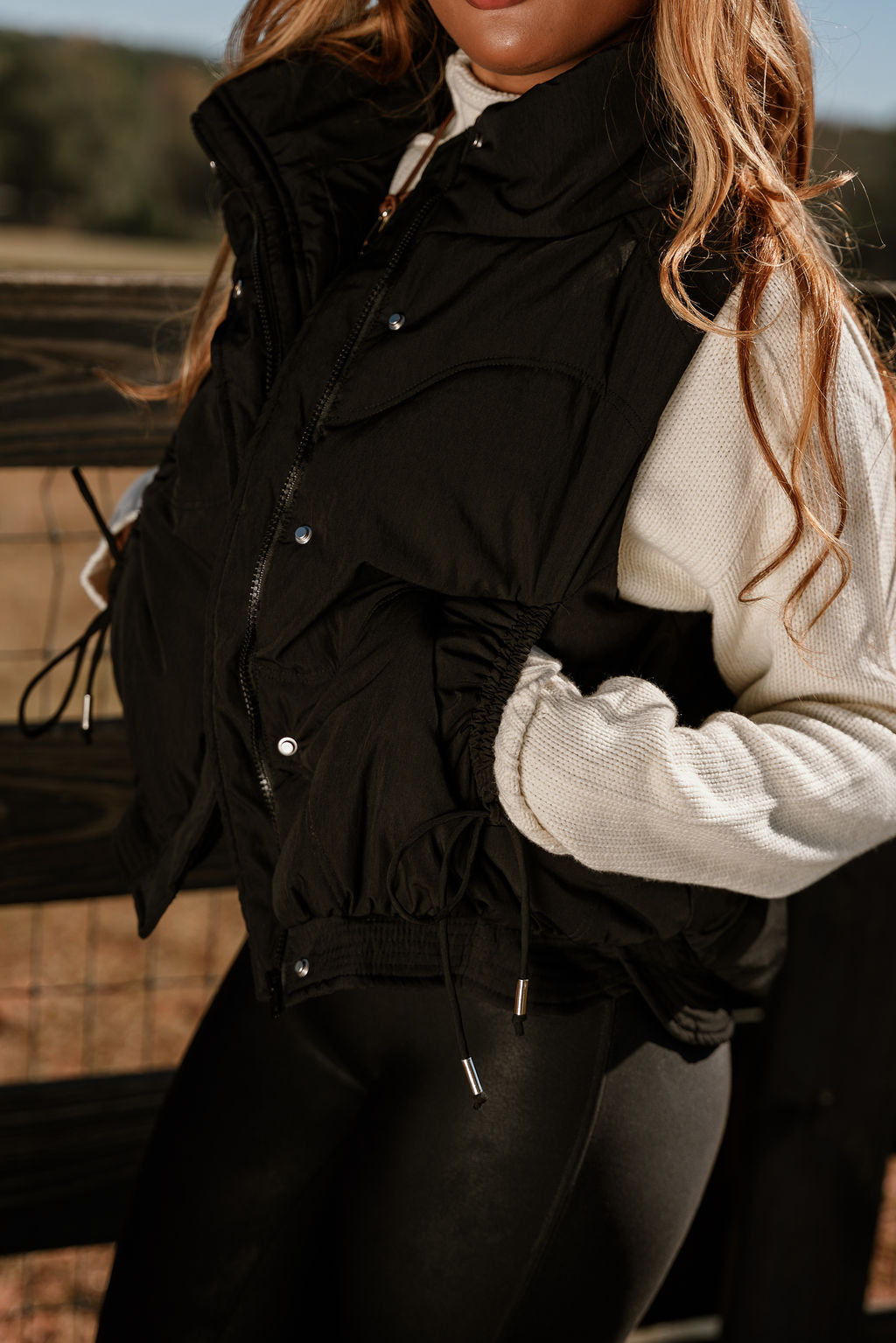 Vera Black Puffer Zip-Up Vest- close up side view