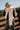 Marlowe Ivory Fringe Scarf - front view wrapped on blonde model 