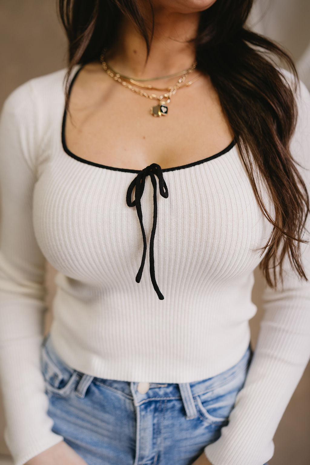 Valeria Ivory & Black Bow Long Sleeve Top- close up top view