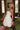 Eloise Cream Rosette & Lace Mini Dress - frontal side view