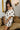 Nia Cream & Black Polka Dot Off-The-Shoulder Dress- frontal side view