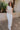 Full body view of model wearing the Lyla Light Taupe Knit Tank which features light taupe open knit fabric, round neckline and sleeveless.
