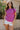 Front view of model wearing the Iris Orchid Purple Sleeveless Top which features orchid purple cotton fabric, round neckline and short sleeves with stitched ribbed hem details.