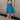Full body view of model wearing the Lucille Dark Turquoise Sleeveless Mini Dress which features dark turquoise fabric, a smocked sweatheart neckline and back, smocked thick straps, and dark turquoise lining.