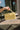 Thea Butter Yellow Faux-Crocodile Purse - front view held by model