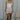 Full body view of model wearing the Juliette Cream Fray Shorts cream textured knit fabric, cream lining, fray hem details, two front pockets and front zipper with pearl button closure.