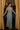 Full body back view of model wearing the Cleo Green & White Halter Twist Midi Dress which features white and green lightweight fabric, geometric design, maxi length, halter twist neckline, sleeveless and open back with monochrome back zipper with hook closure.
