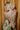 Close up back view of model wearing the Alexandria Multi Abstract Halter Maxi Dress which features yellow, white, orange, green, and pink abstract print, cream full length lining, adjustable straps, a halter neckline with a tie, a low back, and a maxi length hemline.