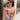 Front view of model wearing the Bianca Satin Floral Tank Top that has sage green satin fabric with a green, purple, pink, yellow, and red floral print and a halter neckline with 3 back button closures. Top is shown tucked into jeans.