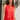 Front view of model wearing the Vada Red Tank Top that features red woven fabric with raw frayed hems, a round neckline, a sleeveless body, small side slits, and a keyhole back with a button closure.