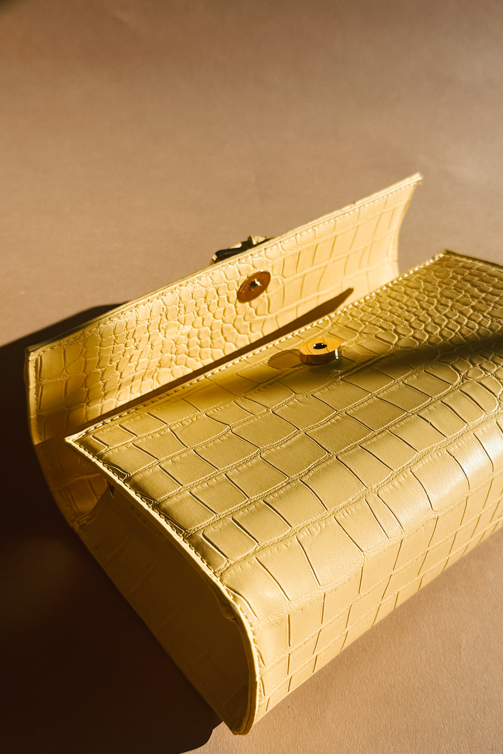 Thea Butter Yellow Faux-Crocodile Purse - laying front view