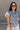 Trinity Light Denim Ruffle Vest- frontal side view