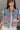 Trinity Light Denim Ruffle Vest- close up front view