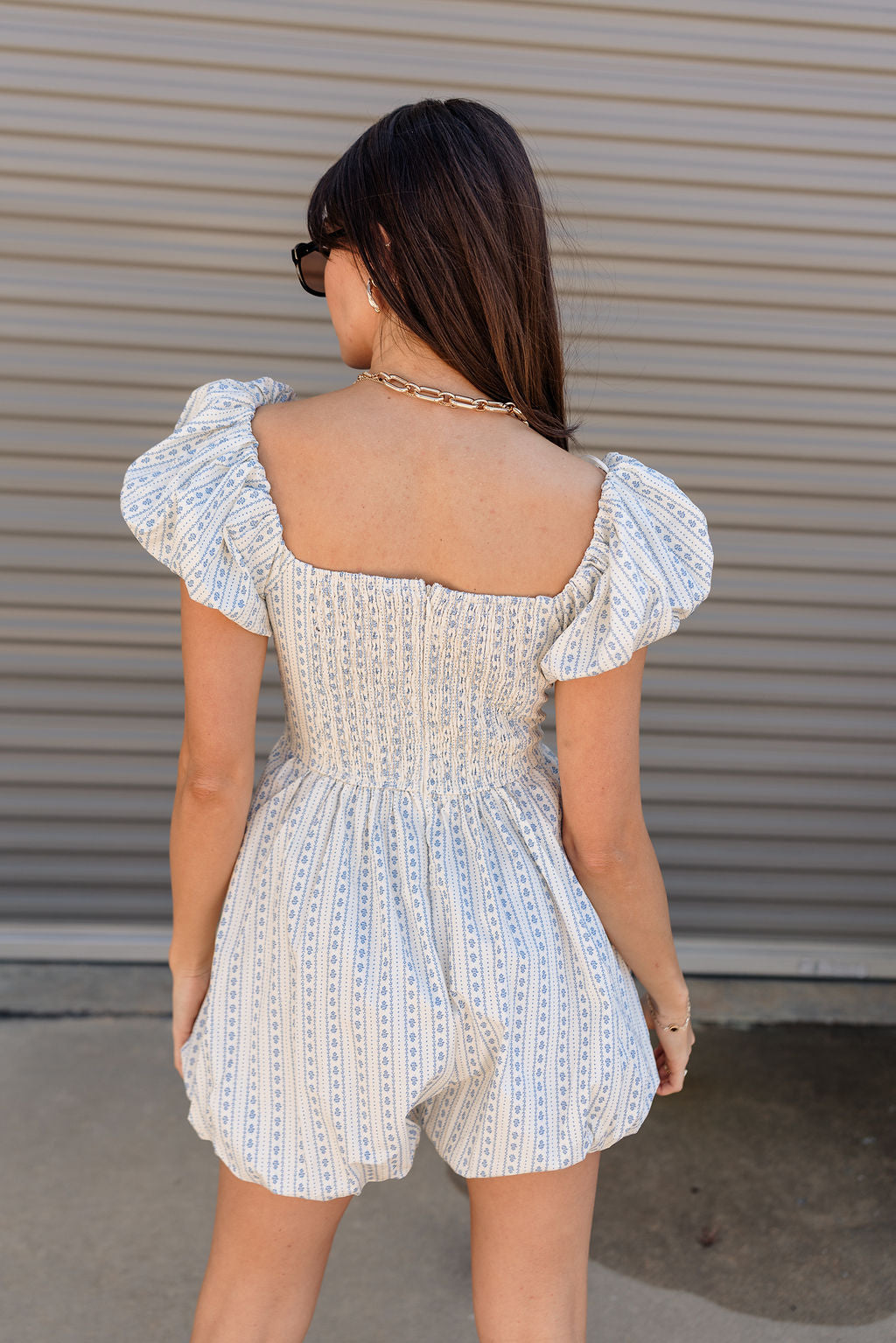 Amalie White & Blue Floral Bubble Romper- close up back view