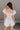 Amalie White & Blue Floral Bubble Romper- close up back view