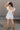 Amalie White & Blue Floral Bubble Romper- full body back view