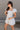 Amalie White & Blue Floral Bubble Romper- full body side view