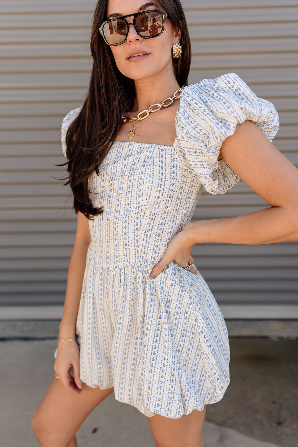 Amalie White & Blue Floral Bubble Romper- frontal side view