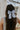 Back view of brunette model's hair; model is wearing the Felicity Hair Bow Barrette in Baby Blue.