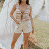 Full body front view of female model wearing the Mallory Taupe & Cream Crochet Tank that has taupe and cream crochet fabric, an open front with a tie, and a sleeveless body. Worn with cream denim shorts.