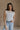 Front view of female model wearing the Elisa Cream Knit Sleeveless Tank which features Cream Cotton Fabric, Open Knit Details, Round Neckline and Sleeveless