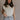 Front view of female model wearing the Vivian Ivory & Navy Knit Sleeveless Sweater which features Cream Cable Knit Fabric, Navy Trim Details, Left Front Chest Pocket, High Neckline and Sleeveless.