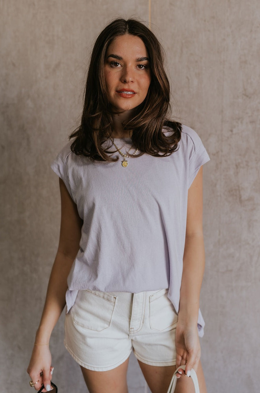 Front view of female model wearing the Khloe Lavender Short Sleeve Top which features Lavender Cotton Fabric, Round Neckline and Short Sleeves