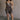 Full body view of female model wearing the Vera Washed Black Sleeveless Romper which features Washed Black Cotton Fabric, Two Side Pockets , V-Neckline, Sleeveless and Adjustable Straps