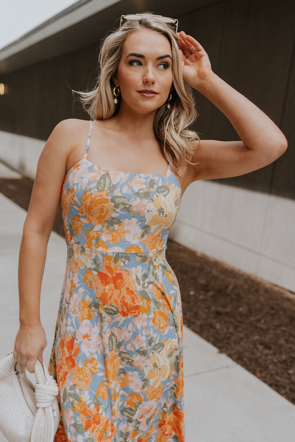 Front view of female model wearing the Paislee Multi Floral Midi Dress which features Blue, Green, Orange, Pink, Red and Yellow Lightweight Fabric, Floral Pattern, Midi Length, Square Neckline and Adjustable Straps