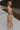 Full body side view of female model wearing the Paislee Multi Floral Midi Dress which features Blue, Green, Orange, Pink, Red and Yellow Lightweight Fabric, Floral Pattern, Midi Length, Square Neckline and Adjustable Straps