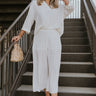 Full body view of female model wearing the ONA Streetworks Slide Heel Sandal in in Honey White & Sea Salt which features Cream Leather Lightweight Upper, Two Thick Straps, Slide-On Style, Traction Rubber Sole and 3" Heel, 1 1/14" Platform 