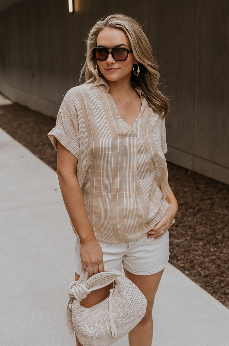 Front view of female model wearing the Kali Light Beige Plaid Short Sleeve Top which features Taupe and White Cotton Fabric, Plaid Print,  Short Sleeves and V-Neckline with Collar