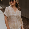 Front view of female model wearing the Kali Light Beige Plaid Short Sleeve Top which features Taupe and White Cotton Fabric, Plaid Print, Short Sleeves and V-Neckline with Collar