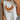 Close up view of female model wearing the Free Bird Smoke Cropped Tank which features Cream Cotton Fabric, Cropped Lettuce Hem, Round Neckline, Sleeveless and Eagle Graphic