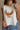 Close up view of female model wearing the Free Bird Smoke Cropped Tank which features Cream Cotton Fabric, Cropped Lettuce Hem, Round Neckline, Sleeveless and Eagle Graphic
