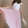 Full body view of female model wearing the Adele Dusty Pink Pleated Tulle Midi Skirt which features Dusty Pink Tulle Pleated Fabric, Dusty Pink Lining, Midi Length and Satin Elastic Band