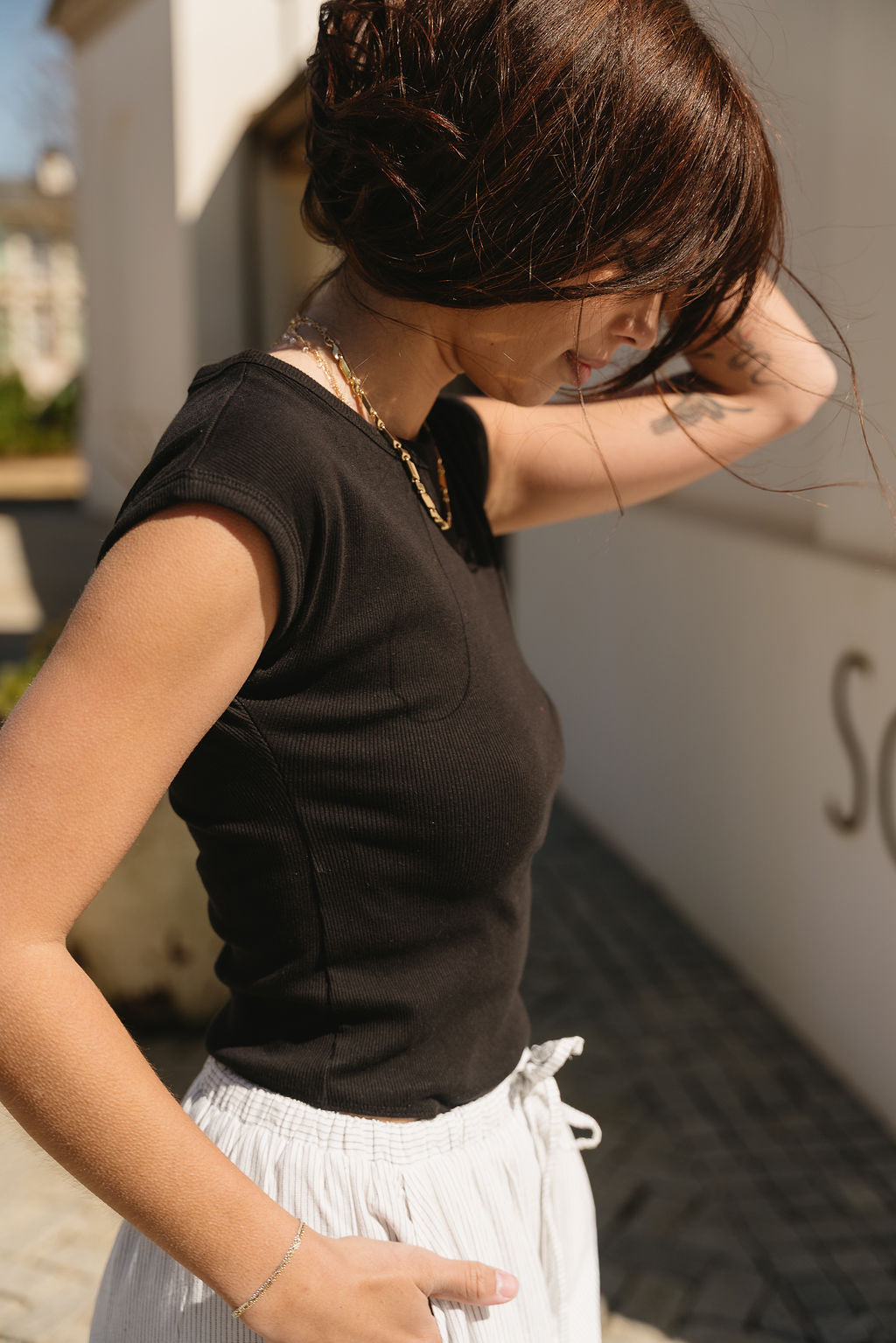 Solana Black Ribbed Short Sleeve Bodysuit- close up side view