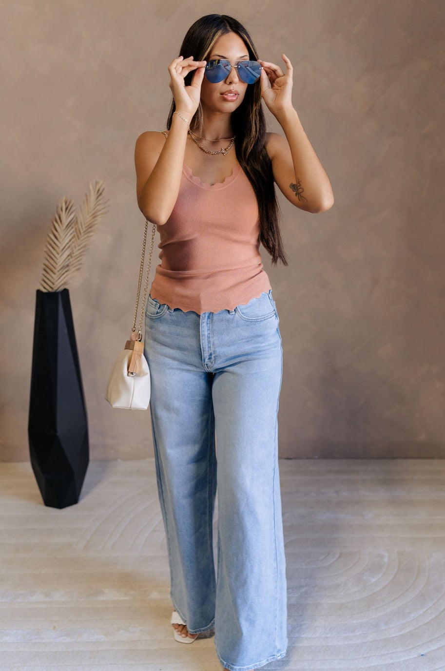 FUll body view of female model wearing the Sophia Scalloped Sleeveles Tank in ginger which features Scallop Hem Details, Adjustable Straps and Sleeveless.