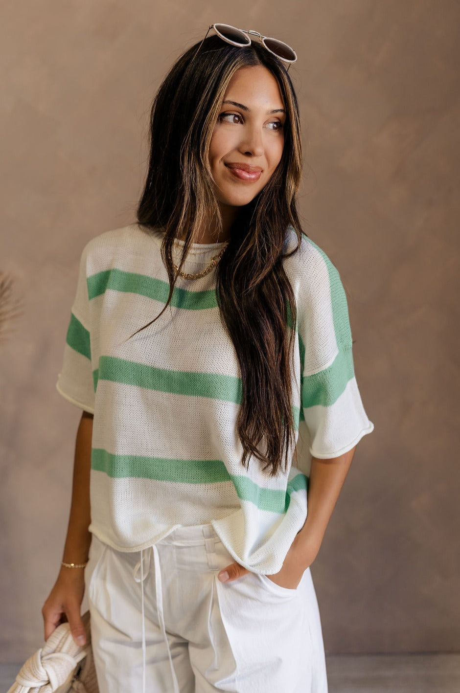 Front view of female model wearing the Camila Green & White Stripe Short Sleeve Top which features Light Green and White Knit Fabric, Stripe Pattern, Round Neckline and Short Sleeves.
